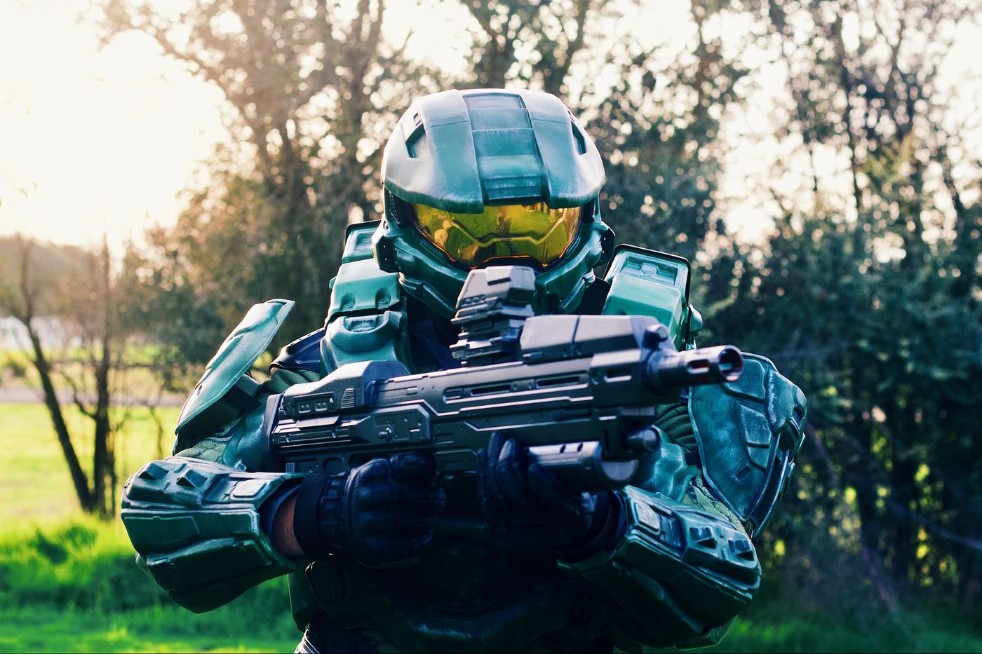 Armored spartan soldier character with rifle prop outdoors
