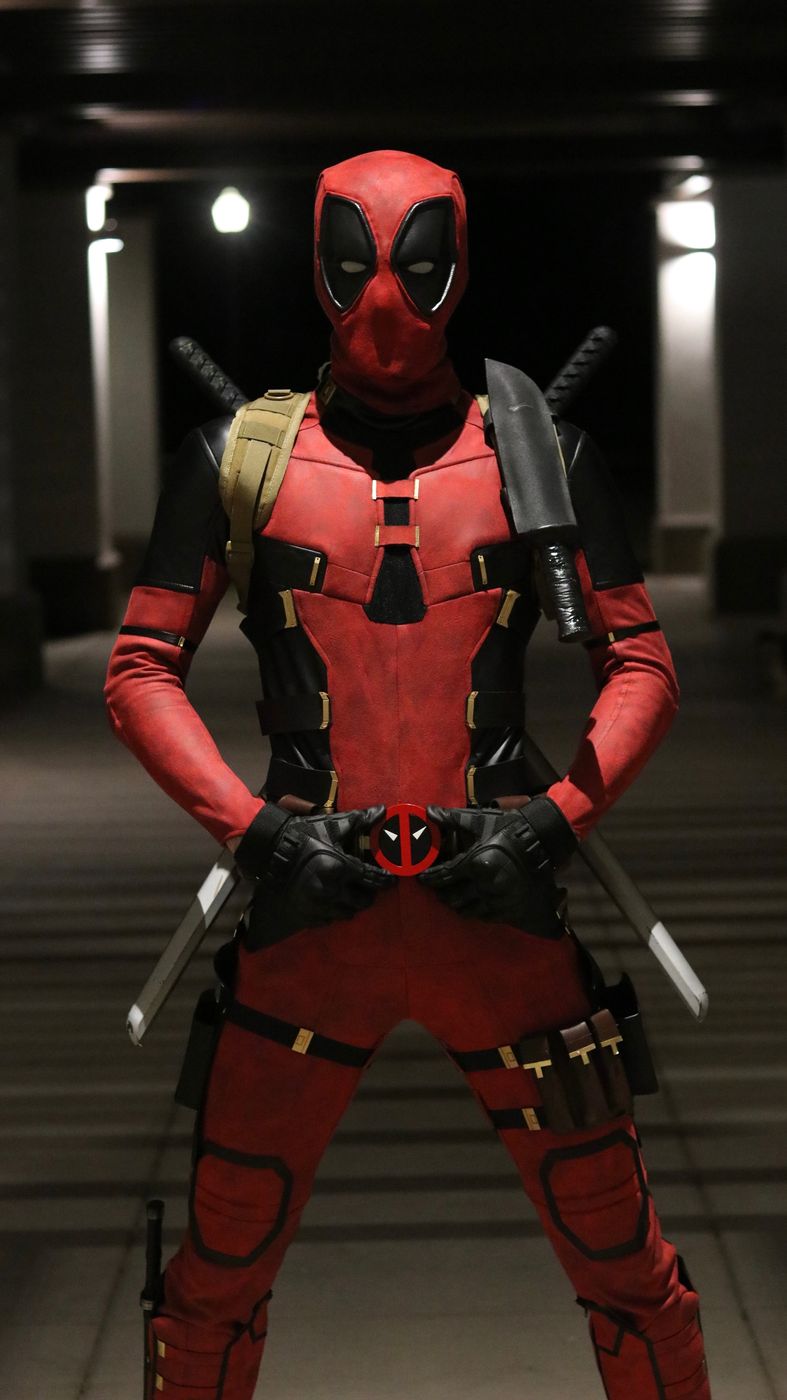 Red-suited mercenary character with sword props